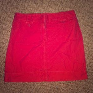 Red mid-thigh skirt